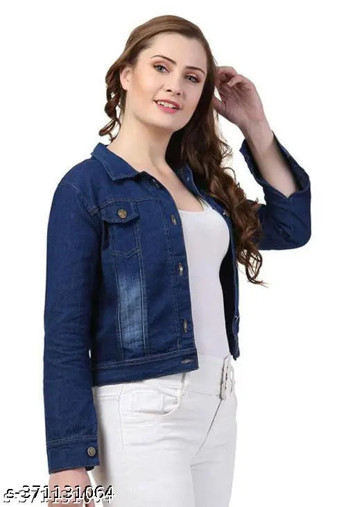 A woman in a light blue crop top with white jeans, wearing a jean jacket