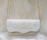 White sequined material, gold chain strap, women's shoulder bag with zip closure