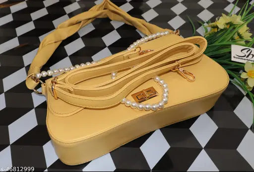 A large, yellow faux leather handbag featuring two detachable shoulder straps and a chic design