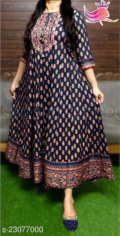 Black and gold embellished kameez with long sleeves, knee-length, side slits