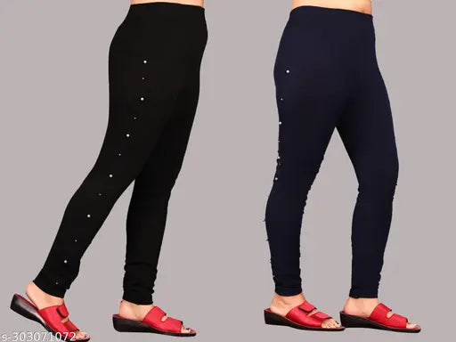 Black and navy blue Lycra jeggings pack of 2 for modern women's gym or yoga wear, featuring criss-cross design and high elasticity. Available in sizes 24, 26, 28, 30, 32 (waist size 24-32, length size 37in). Origin: India