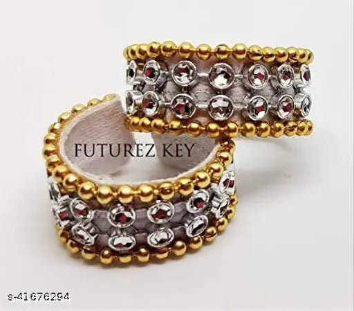 Golden handmade Futurez Key Laddu Gopal jewelry set, featuring mukut, necklace, bangles, and flute. Made with imitation gems and decorative pieces for a shining and attractive idol. Premium quality, golden color with multicolor patterns. Indian origin