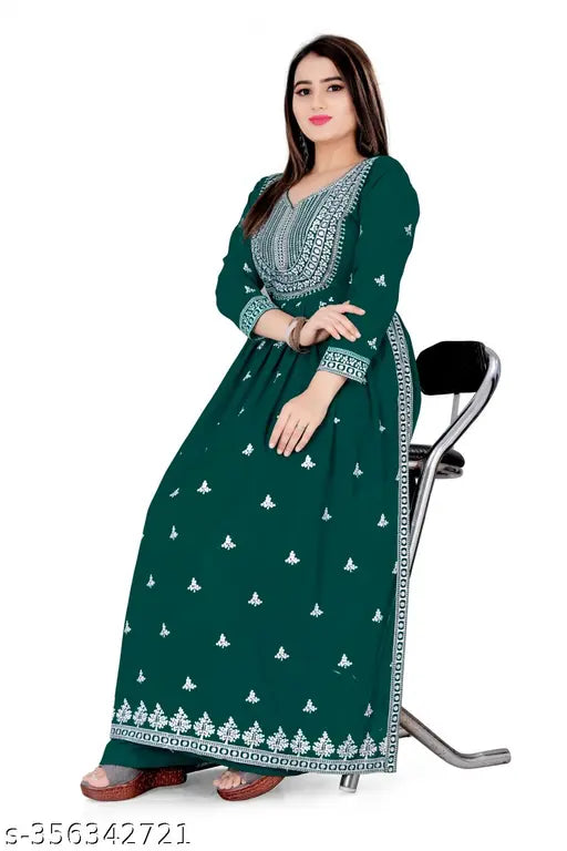 Georgette embroidered Nayra cut straight fit gown with palazzos, three-quarter sleeves, and resham, zari, lace work. Dark green women's long gown from India