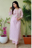 Pink rayon kurta set with palazzos, printed net design, three-quarter sleeves, XL size, Indian ethnic wear on display stand with matching printed pants and transparent sandals