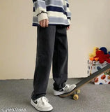 The image shows a pair of black jeans with a western design, likely for boys or young men