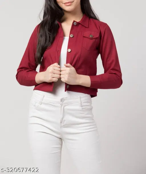 A girl standing in a red denim jacket