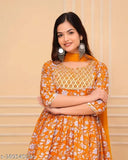 Women's fashionable rayon embroidered anarkali kurti set, including sharara and dupatta, presented in a stylized manner