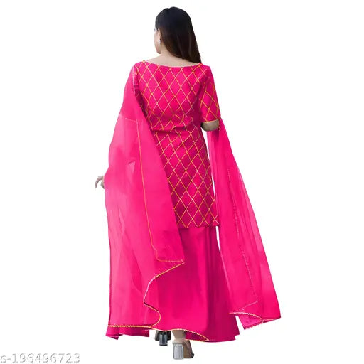 A woman in a magenta embroidered checked work half-sleeved kurta with matching palazzo pants and dupatta set