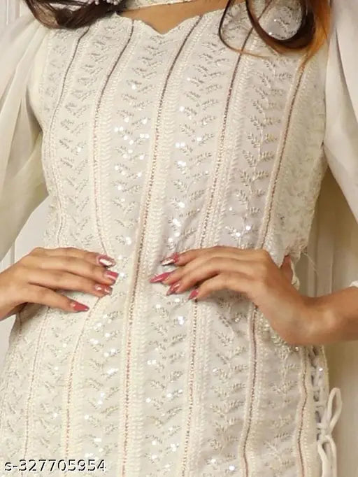 Embroidered Georgette kurta and Sharara set with sequins embellishment, three-quarter sleeves, side tie-ups. Georgette dupatta included. Available in S, M, L, XL sizes. Made in India