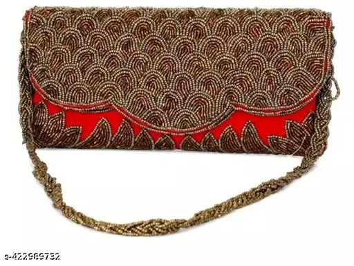 Golden embroidered clutch with decorative strap and metal zipper