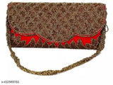 Golden embroidered clutch with decorative strap and metal zipper