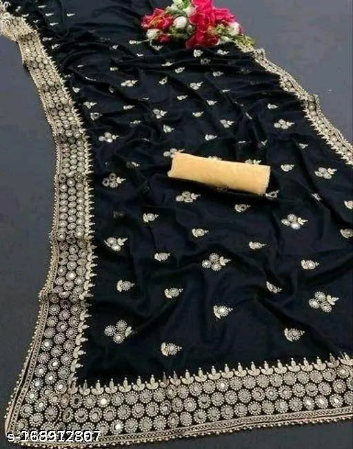 Trendy Ritu Mirror saree, black and blue lehenga with silver embroidery, red flower decoration