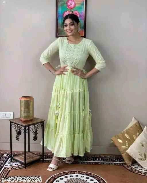 Light green LUREX embroidered flared gown for women, three-quarter sleeve rayon dress with intricate patterns on mannequin