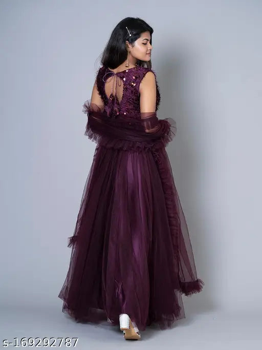 Embellished jute-silk ruffle lehenga choli set in wine color, featuring a padded blouse and matching dupatta. Traditional-meets-indo-western design for women's and girls' wear." (107 characters)