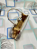 Trendy black clutch with multiple pockets and a decorative brooch
