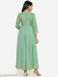 Green rayon printed Anarkali Kurta with embroidery, perfect for parties or casual events. Single size: XS (32" bust, 52" length). Indian handcrafted authenticity assured by INDIANIC brand