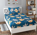 Blue floral printed bedsheet with orange pillow cover, single bed set.