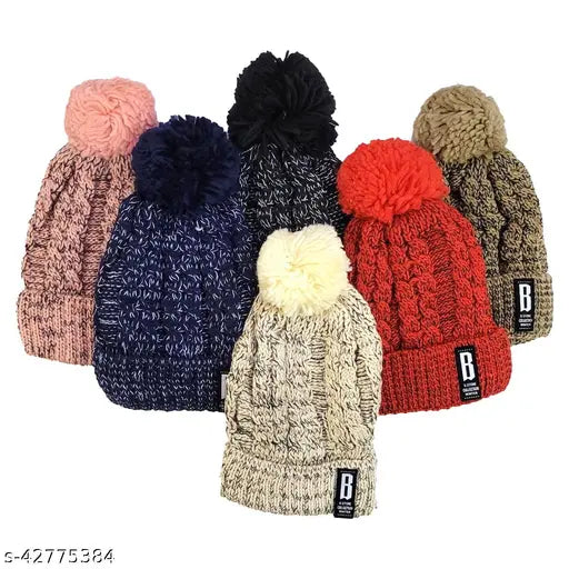 Navy blue woolen beanie cap with fur lining and soft pompom