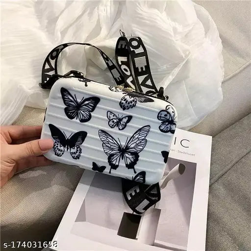 A black cosmetics bag, detachable shoulder strap, convertible into box bag, butterfly pattern, for women