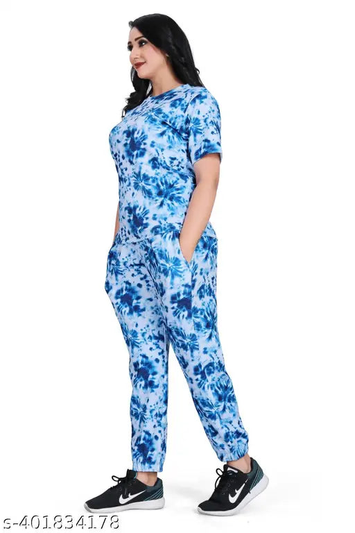 Blue crepe co-ord set with printed design, featuring a top and trousers for women's fashionable traditional look. Made from cotton and lycra blend for comfort. Multicolor pattern, straight fit top with extra 1 inch margin for customization. Indian origin