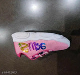 Pink, white, and black sports shoe with pink laces