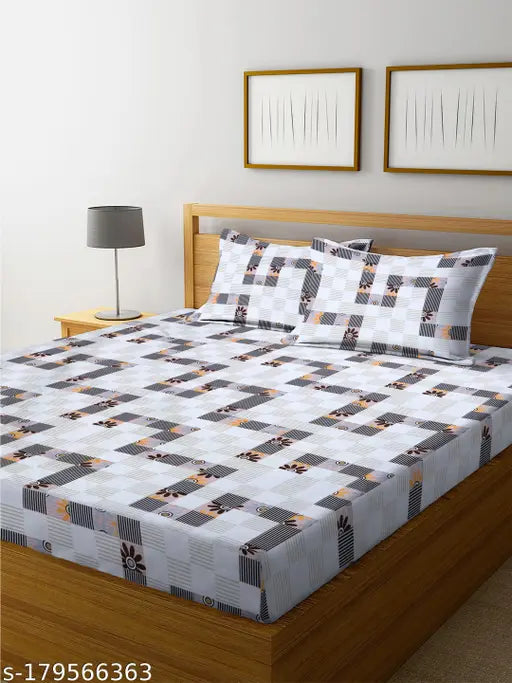 White microfiber bedsheet set with pillow covers by Shree Ram Decor, featuring a checked pattern and elastic bands for a snug fit on deep mattresses. Machine washable for easy care