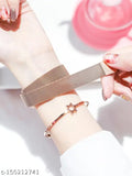 Two-tone black and rose gold analogue watch featuring a delicate design with a heart shape in the center and a butterfly on one side, paired with a matching bracelet