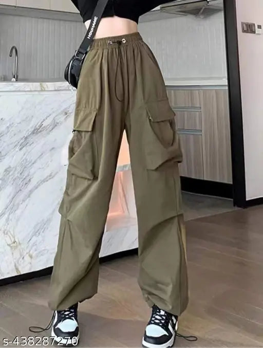 Girls' black pants with baggy silhouette and side pockets