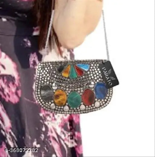 Silver metallic PARATO women's clutch or sling party bag with multiple pockets and strap, featuring a large central colorful jewel-like decoration