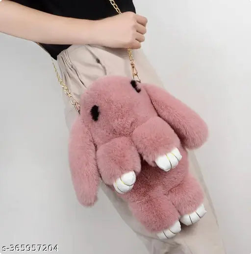 Pink stuffed animal keychain with a purse strap