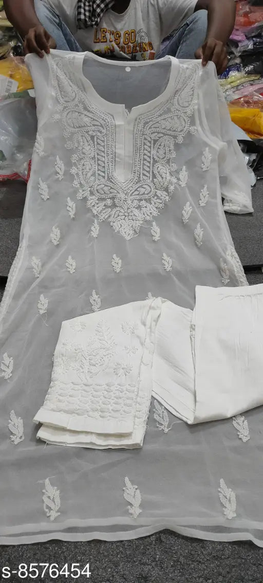 White georgette kameez with shararas on a hanger