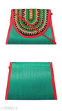Green silk sling bag with red trim and zip closure