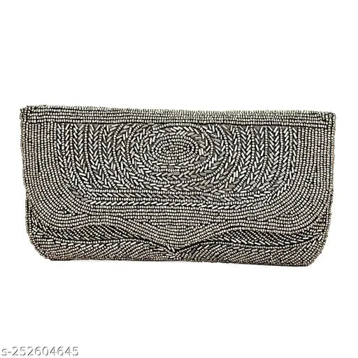 A beaded, textured, black clutch purse with a spacious compartment