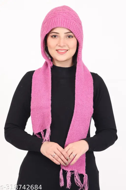 Pink fuzzy scarf around neck, wearing black top