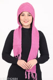 Pink fuzzy scarf around neck, wearing black top