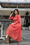 A person is wearing an embroidered red kameez on a patio