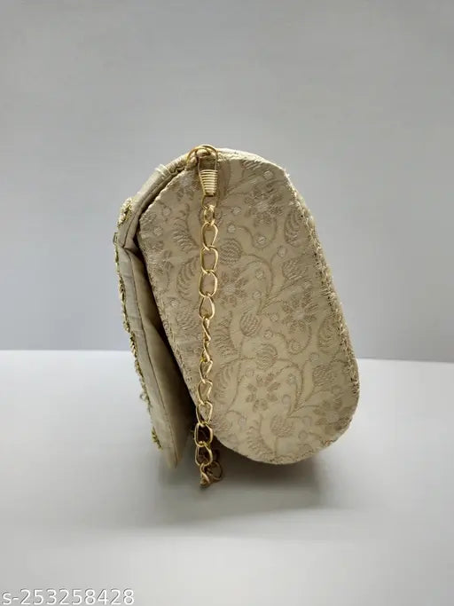 Handstitched roll clutch with floral pattern, gold chain closure