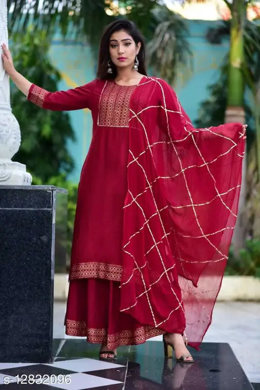 Red and gold embroidered kurta set with sharara, long sleeves, floor length
