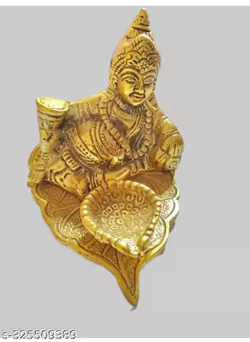 Metal leaf Kuber Diya with paan design, aluminum home decor gift. Dimensions: 25 x 10 x 10 cm. Origin: India