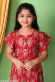 Girl in red dress with flared sleeves