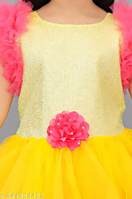 Long net frock in a girls' kid's gown dress, yellow satin with pink ruffles
