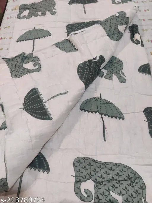 Grey, black and white quilt with wildlife theme