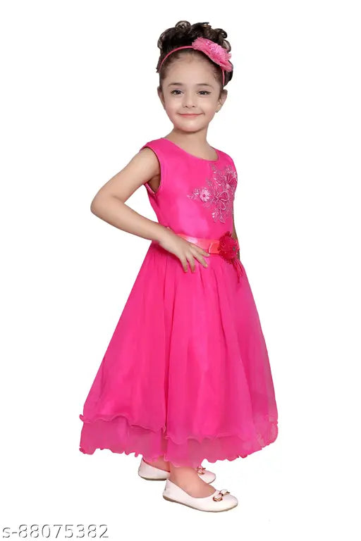 A pink embellished children's party dress with a V-neck and full skirt