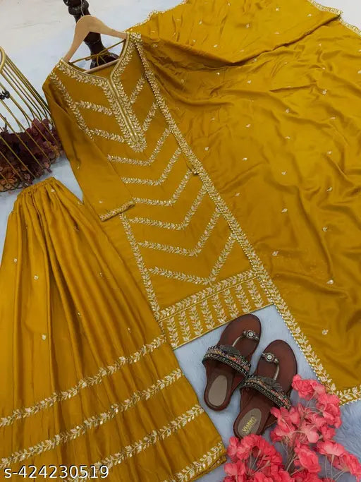 Gold and black embellished silk churidar suit, with traditional embroidery