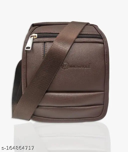 Brown leather sling bag with adjustable strap, spacious main compartment, and multiple pockets