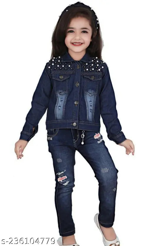 Young girl in blue denim jacket and black pants, standing against white background
