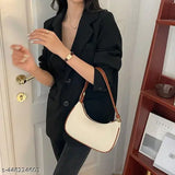Black leather shoulder bag with multiple compartments and a top handle