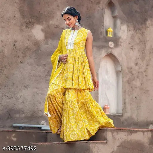 Bright yellow bandhani print anarakali kurta set with dupatta, sharara, and skirt for women