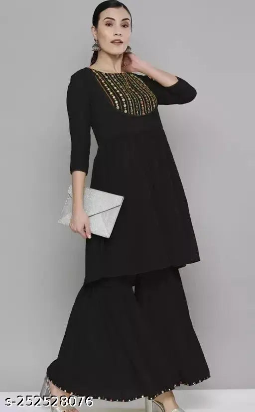 Black georgette kurta with sequin embroidery, long sharara style bottoms, sleeveless, embellished with sequins and embroidered design