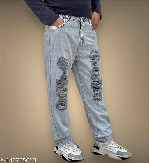 Men's distressed denim jeans with a zip fly and front pocket detailing